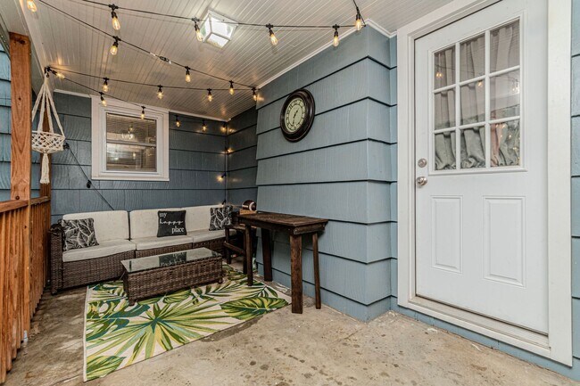 Building Photo - Back porch with a large yard!