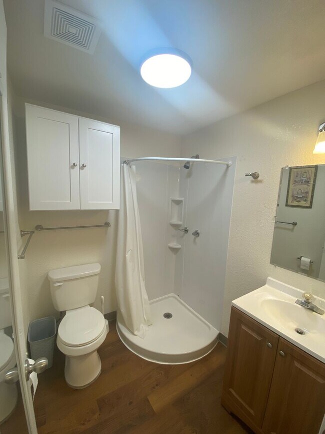 Building Photo - Adorable studio with large garage and work...