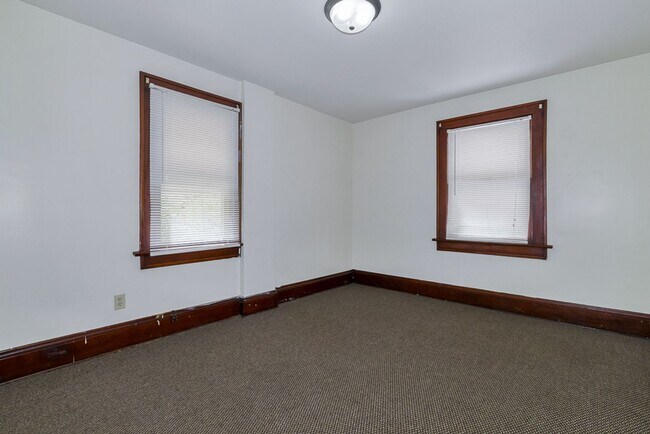 Building Photo - Charming 3BR Home with Classic Woodwork, Porch & Bonus Attic Space