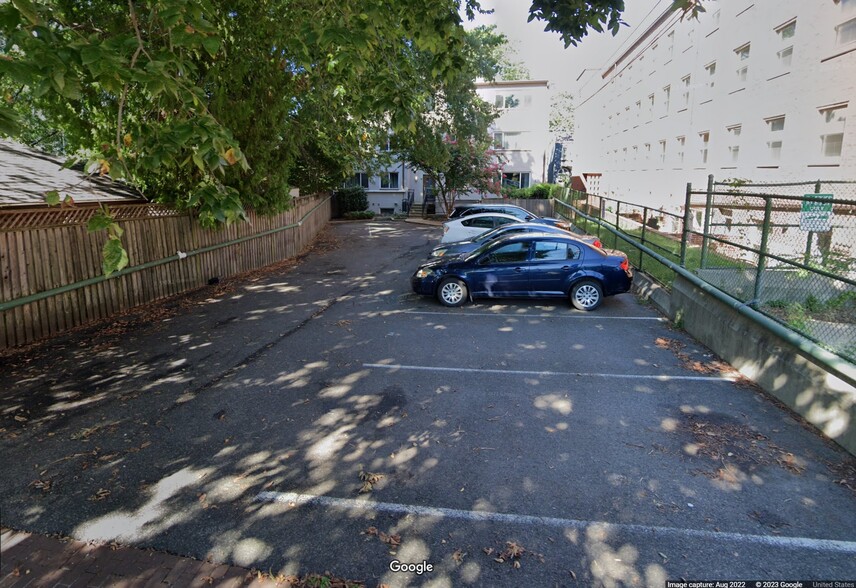 Parking lot behind building with dedicated spot for unit - 1907 3rd St NW