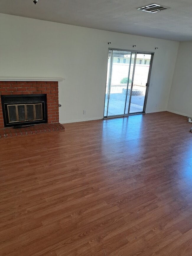 Fireplace and backyard door in Family room - 37727 Maureen St