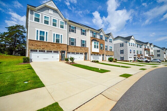 Building Photo - 3 Bedrooms | 2.5 Bathrooms | Lower-Level Flex Room | Approximately 1,978 Square Feet | 2-Car Gara...