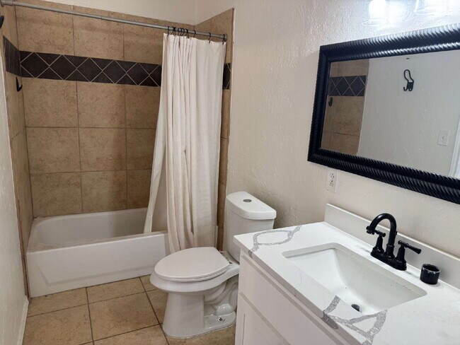Building Photo - "Charming 4-Bed Lubbock Retreat: Granite Kitchen, Hardwood Elegance & Cozy Fireplace!"