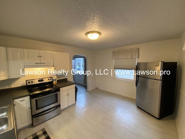 Building Photo - Well Maintained Three Bedroom with Fenced Yard and Shed