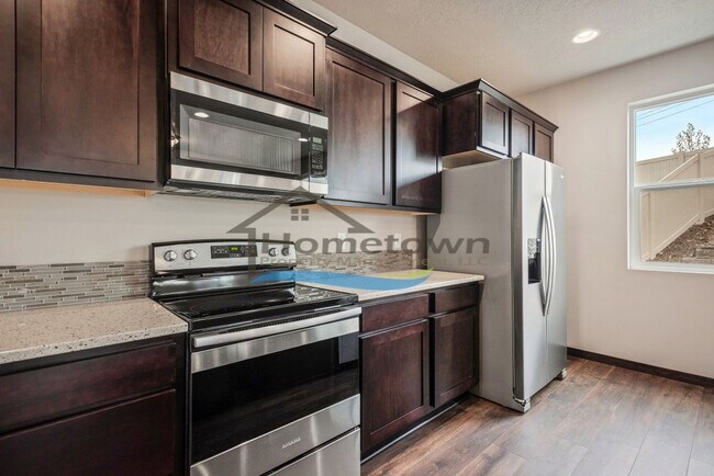 Building Photo - Woodbridge South Home with 4 Bedrooms and 3 Bathrooms in Post Falls build in 2021!