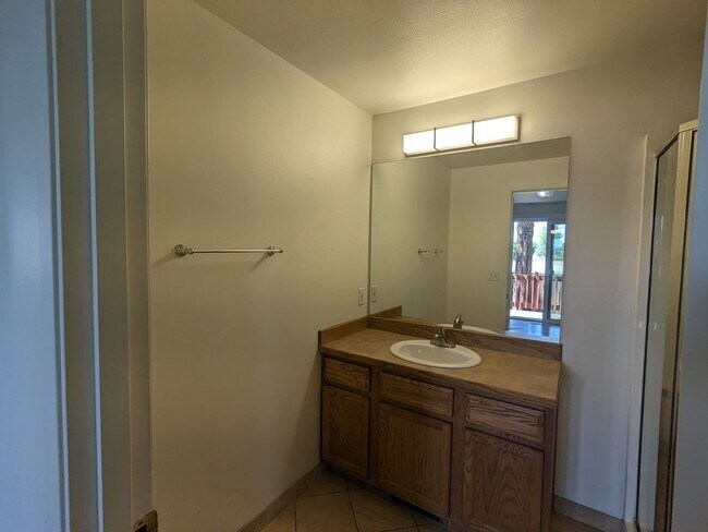 Building Photo - 2x2 duplex with a fenced yard, single-car ...
