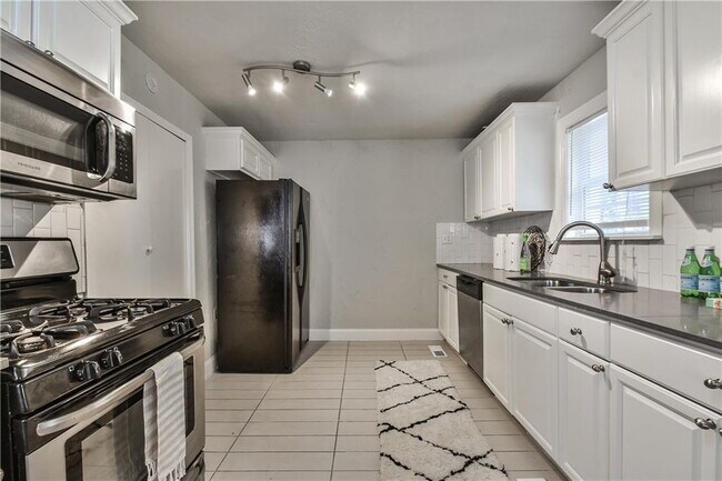 Building Photo - This is where timeless style meets today's conveniences.