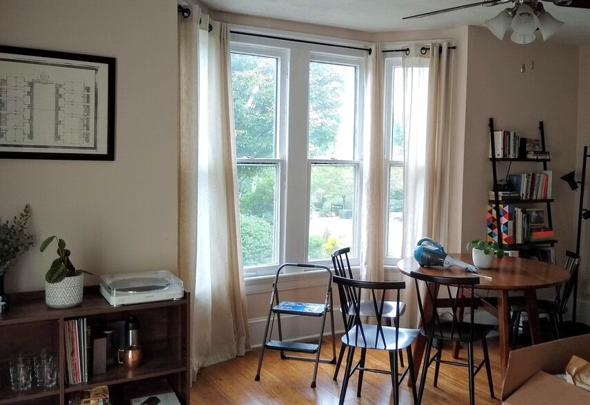 Bay window with dining table in living room - 205 Douglas Avenue