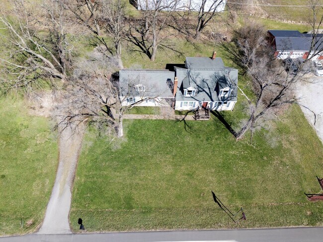Building Photo - Four Bedroom Single-Family Home