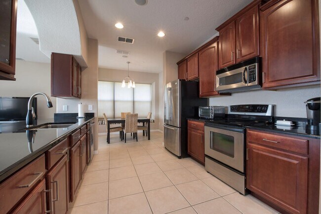 Building Photo - Large, Executive style 3/2.5 Lakefront/POOL Home in East Park of Lake Nona