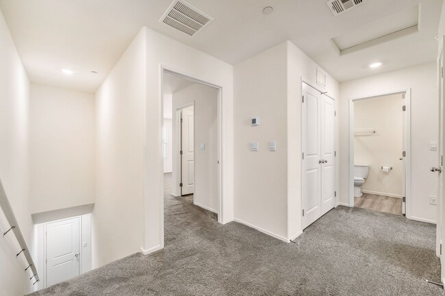 Building Photo - Modern West Henderson Townhome with Sleek Upgrades & Smart Home Features!