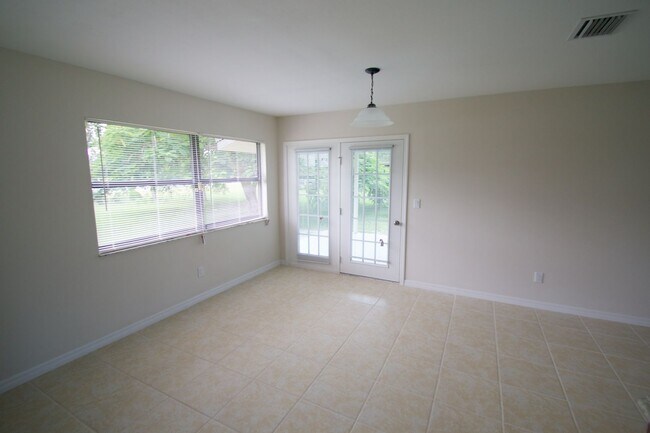 Building Photo - Waterfront 3BR Home on Canal | Spacious Yard | Lawn Care Included | Pet Friendly