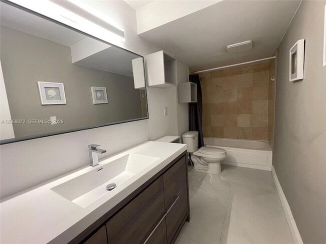 Building Photo - 10275 Collins Ave