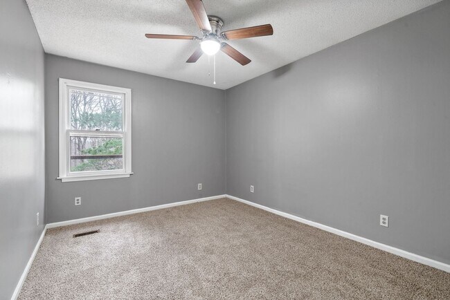 Building Photo - Lovely home on beautiful, wooded corner - Just Reduced