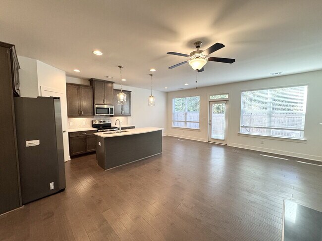 Building Photo - Stylish 3BR Townhome with Private Yard & T...