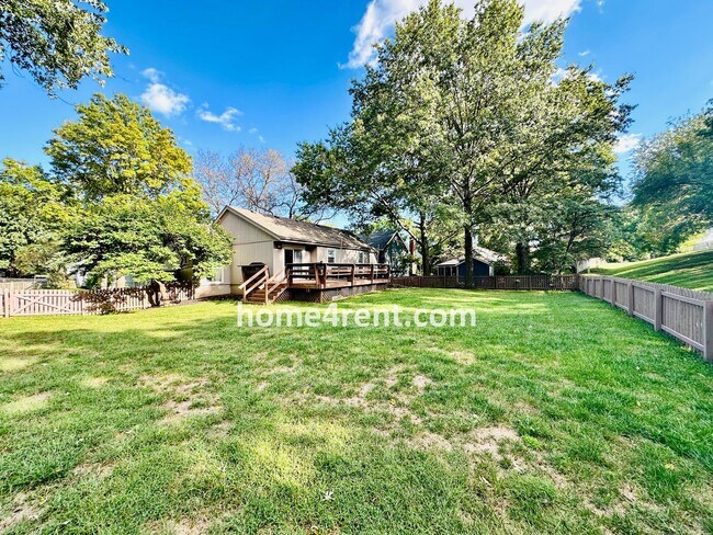 Building Photo - A Lovely Lenexa Home w/ Wood Floors Throughout, Updated Kitchen, Finished Basement and a Fenced Y...