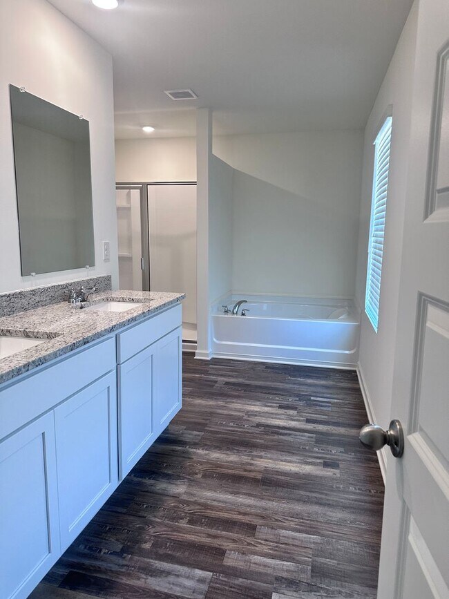 Building Photo - efficient two-level home provides a large living room, 4 very spacious bedrooms, and 2.5 bathrooms