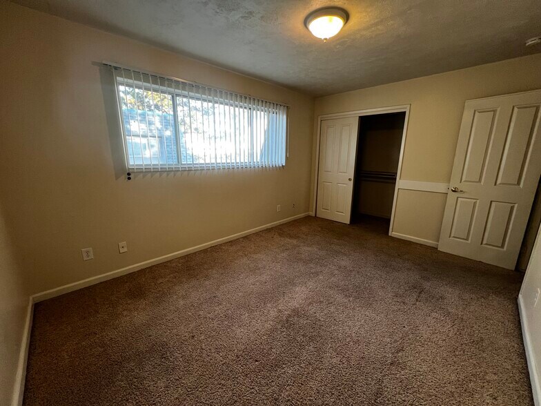 Primary bedroom with extra shelving in closet - 888 Rutledge Dr
