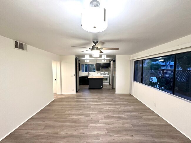 Transition from living room to kitchen space. - 5303 Alhama Dr