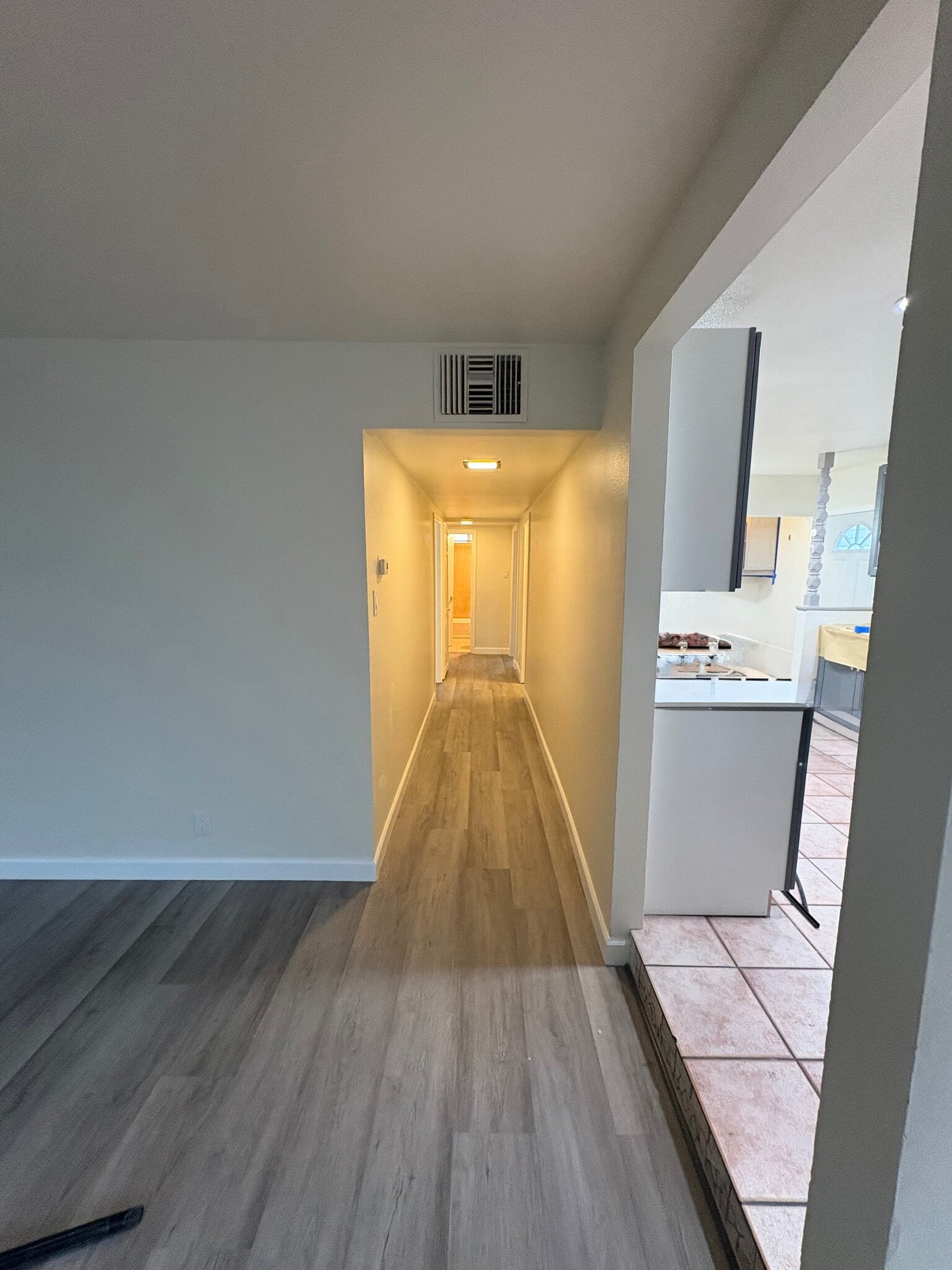 Exit the kitchen and immediate right is the central hallway to three bedrooms and the bathrooms - 23162 Smith Rd