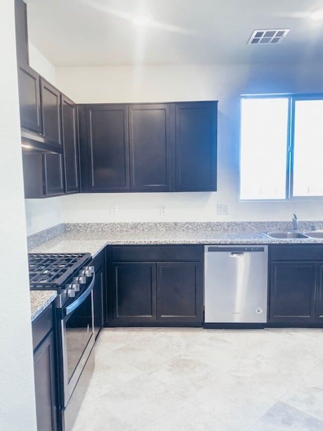 Building Photo - Beautiful Townhome in a Gated Community with 2-Car Garage!!