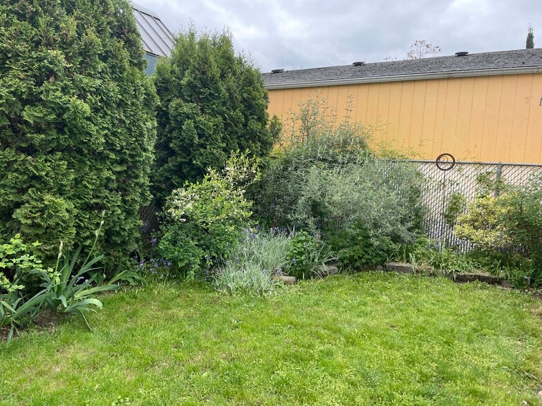 It's a hummingbird and butterfly paradise - 3405 NE 80th Ave