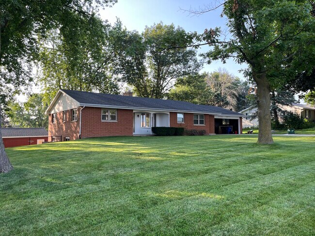 Home set back from road; mature trees provide shade in summer - 2790 S Ridge Rd