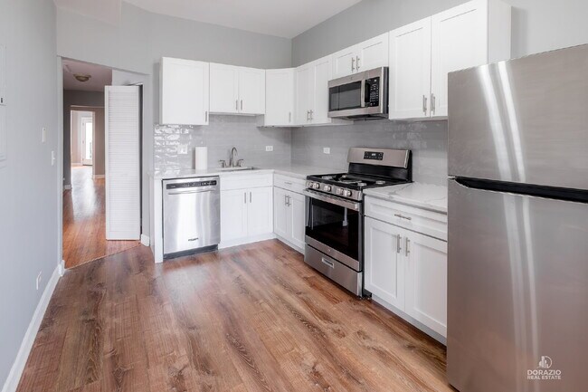 Building Photo - Modern 4BR Apartment with Hardwood Floors, Balcony & Central A/C