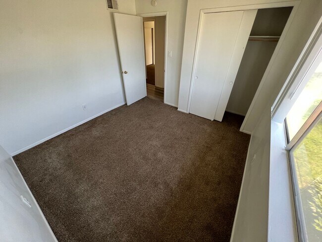 Building Photo - 4 bedroom 2 bath,  fenced yard w/ fruit tr...