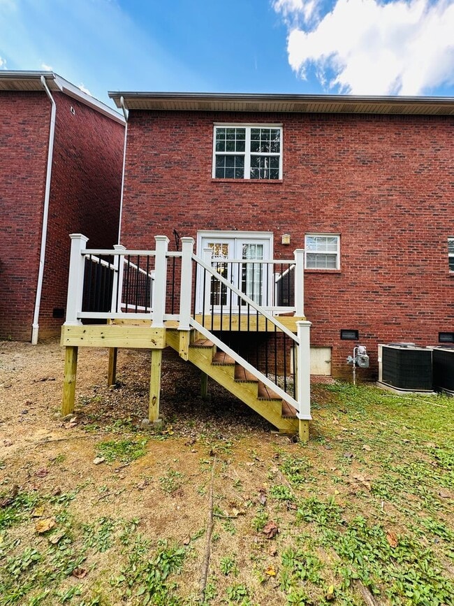 Building Photo - 2 bed, 2.5 bath updated townhouse w/ 1-car garage & Trex deck available now