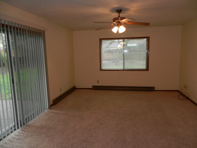 Building Photo - Well-Located Home with Fireplace, Fenced Yard & 2-Car Garage