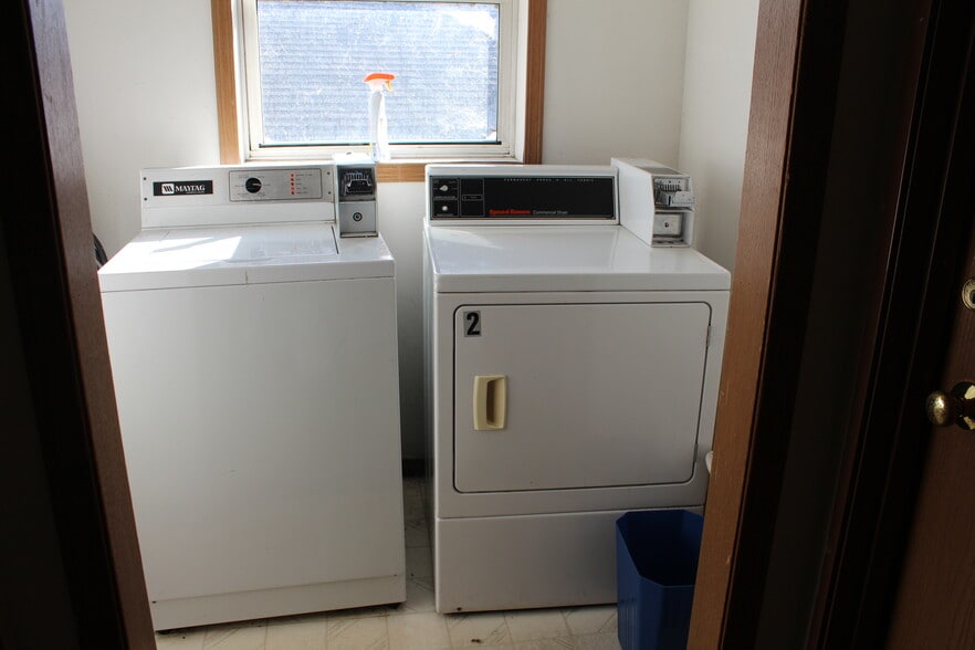 Coin-operated laundry in building - 1008 Elmwood Ave