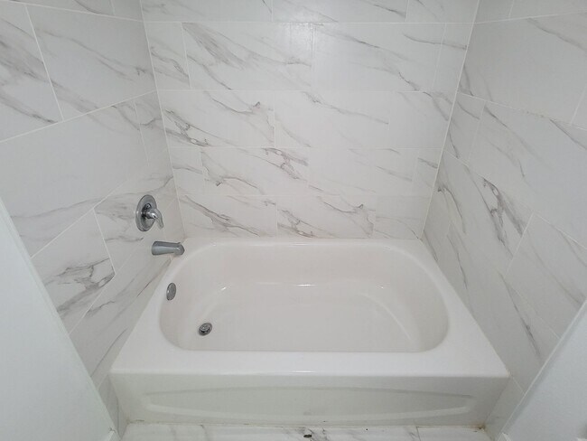 Building Photo - This newly constructed 3-bedroom, 2-bathroom unit offers modern living with 1,150 sq ft of space....