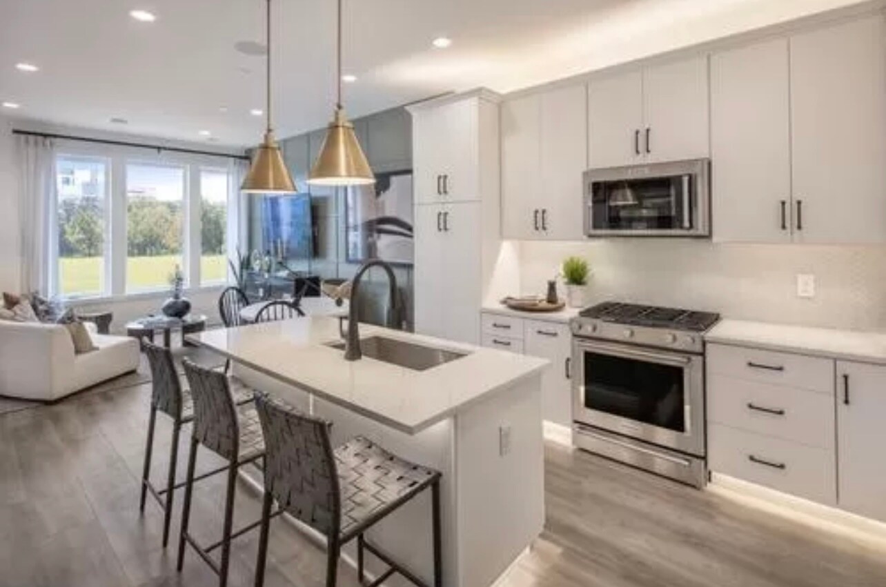 Model house reference photo of open concept kitchen - 609 Brewster Aly