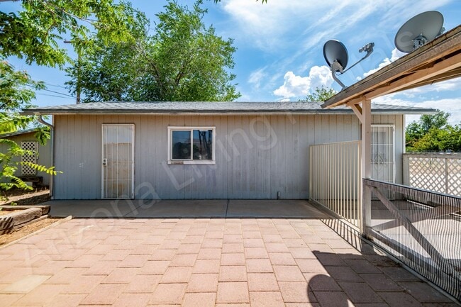 Building Photo - LARGE FENCED YARD WITH DETACHED GARAGE