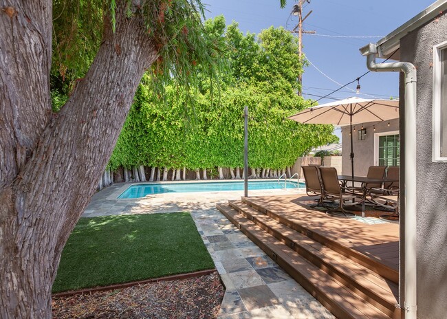 Building Photo - *Unfurnished* Gorgeous 4-Bed Oasis with Po...