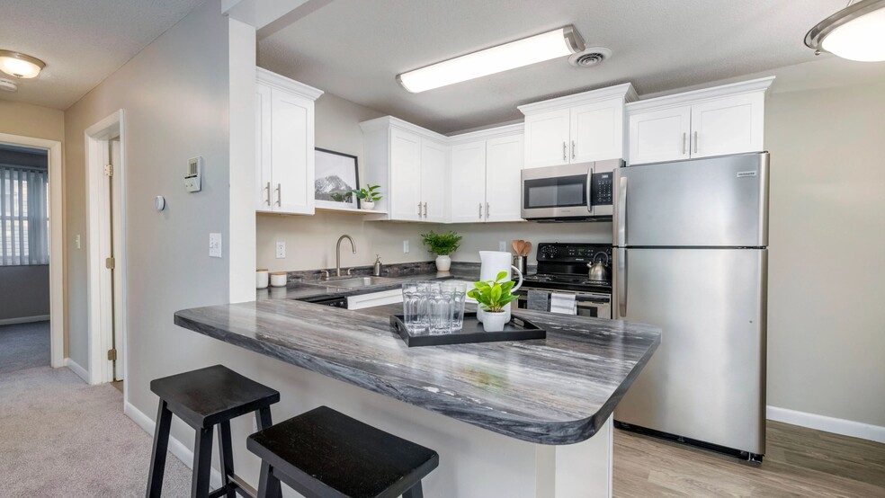 Enjoy the modern allure of our well-appointed kitchens featuring stainless steel appliances, spacious countertops, and ample cabinetry for your convenience. - Welby Park Estates