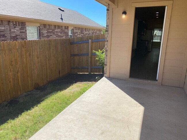 Building Photo - Three Bedroom, Two Bath, Two Car Garage, Washer and Dryer are included.