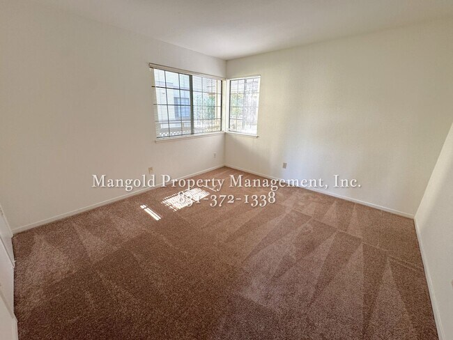 Building Photo - Spacious 2-Bed, 2-Bath Condo with Fireplac...