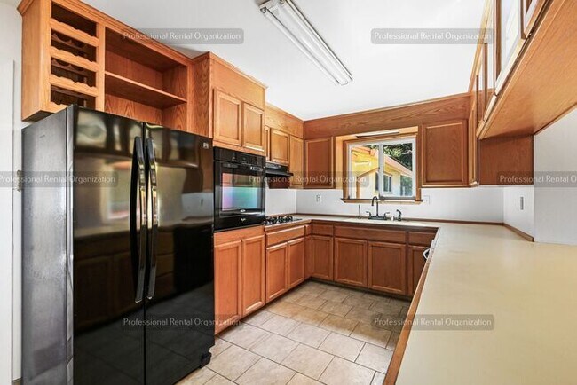 Building Photo - Look No Further, this home has it all- Hot Tub, Sauna, EV Charger, Solar, KOI Pond & More