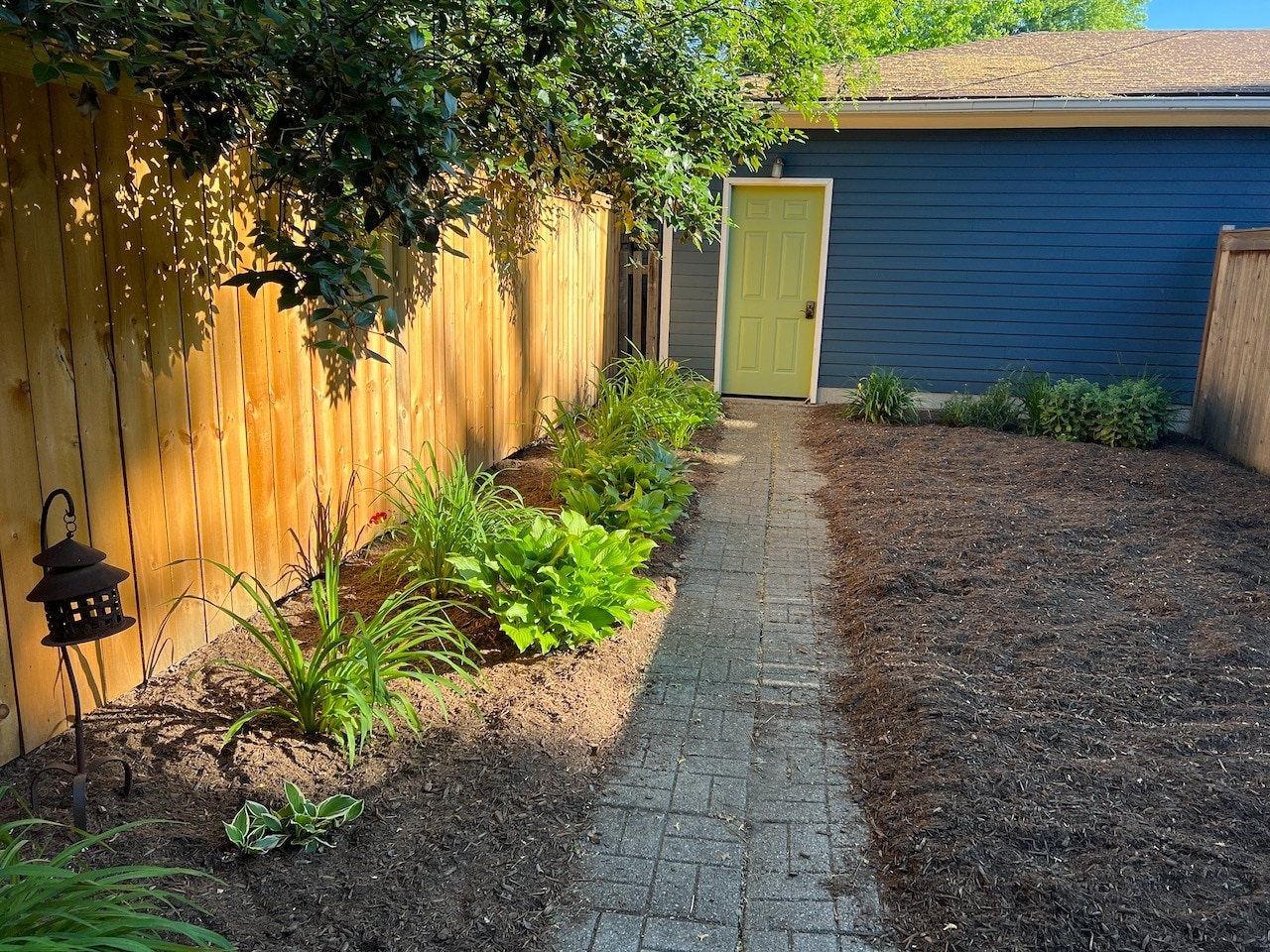 Fully fenced backyard and detached garage - 232 E 10th St