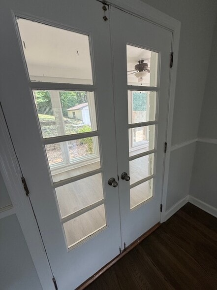 Glass doors in dining room looking into a bonus "sun room" - 111 Woodmore Ave