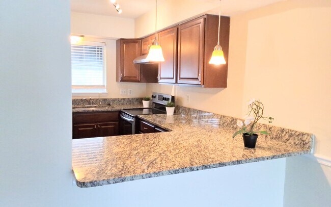 Building Photo - Stunning all remodeled 2/1.5 condo with Am...