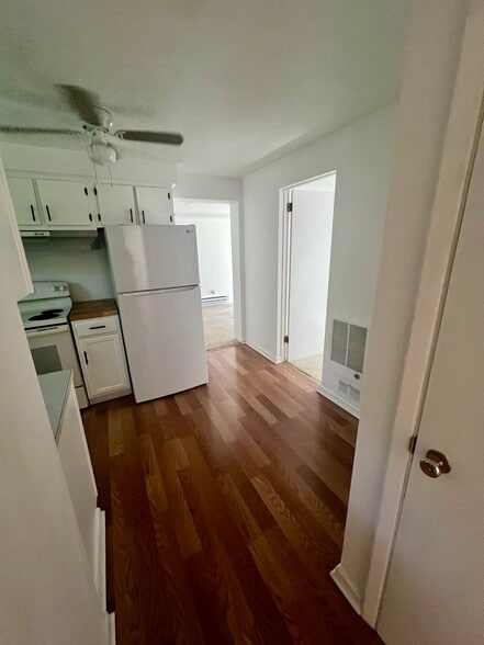 Kitchen hallway to living room and smaller bedroom - 2612 Louisiana Ave