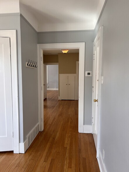 View from living room through the dining room into the bedroom. - 210 S Laurel St