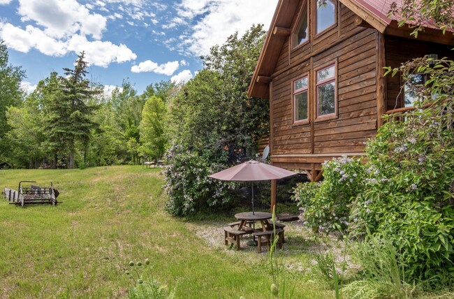 Building Photo - Charming Log Cabin and Carriage House – Do...