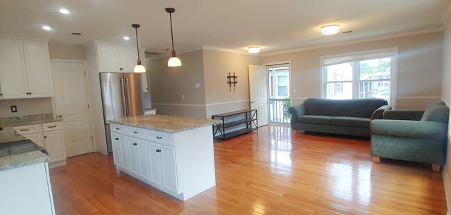 Open plan living area, view one, mostly unfurnished. TV mount included - 819 Page St