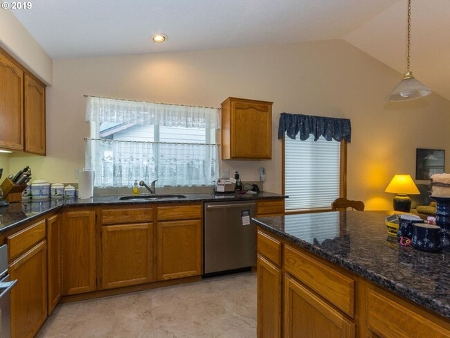 Building Photo - Charming 4-Bed, 2-Bath Home with Vaulted Ceilings, Dual Fireplaces & Serene Outdoor Spaces