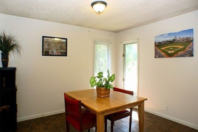 Building Photo - Corner Lot Charm: Spacious 3-Bed Home with Fireplace and Prime Location