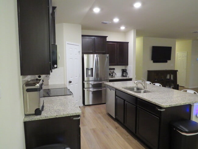 Building Photo - "Charming 3-Bedroom Home with Elegant Gran...